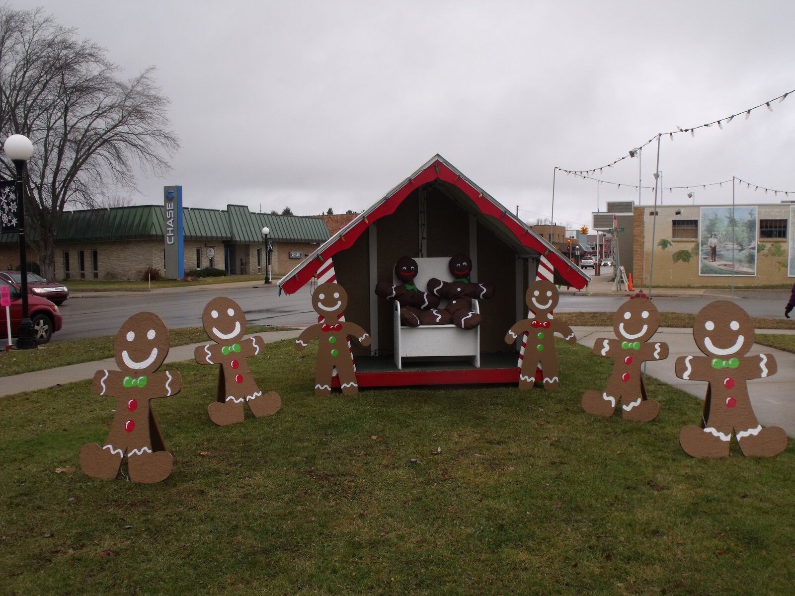 The Santa House on the lawn downtown, surrounded by life-size gingerbread figures